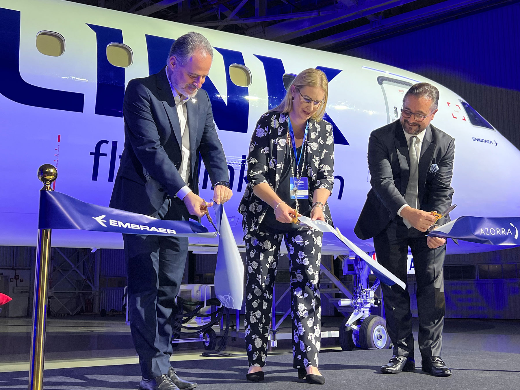 Ribbon cutting in front of a brand new Airlink Embraer E195-E2, (L-R): Embraer President & CEO, Services & Support, Carlos Naufel; Airlink Chief Commercial Officer, Katherine Whelan; Azorra Chief Marketing Officer, Michael Davis