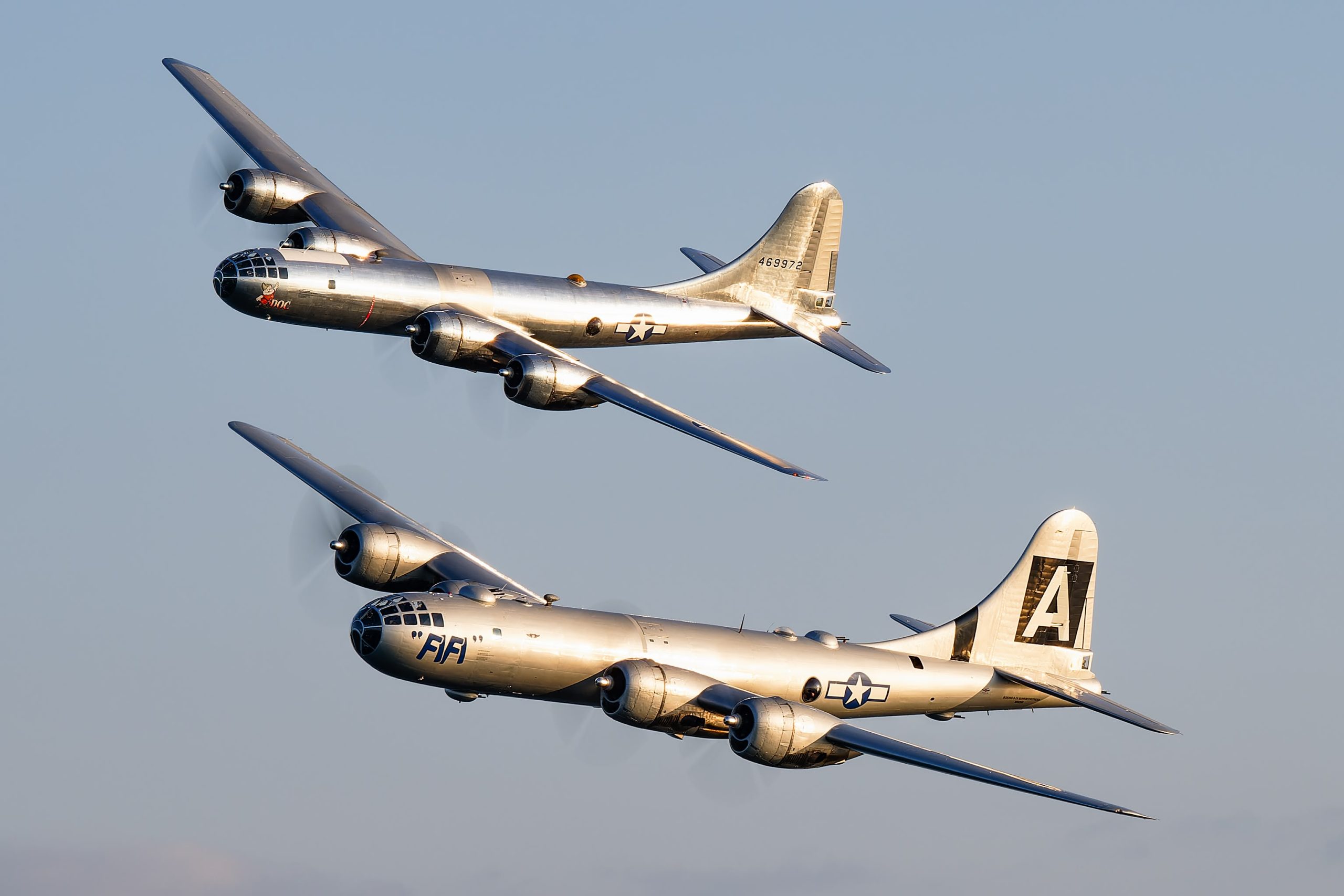 B-29 Doc and B-29 FIFI fly in formation over EAA AirVenture Oshkosh 2024. © Dylan Phelps / Centerline Images