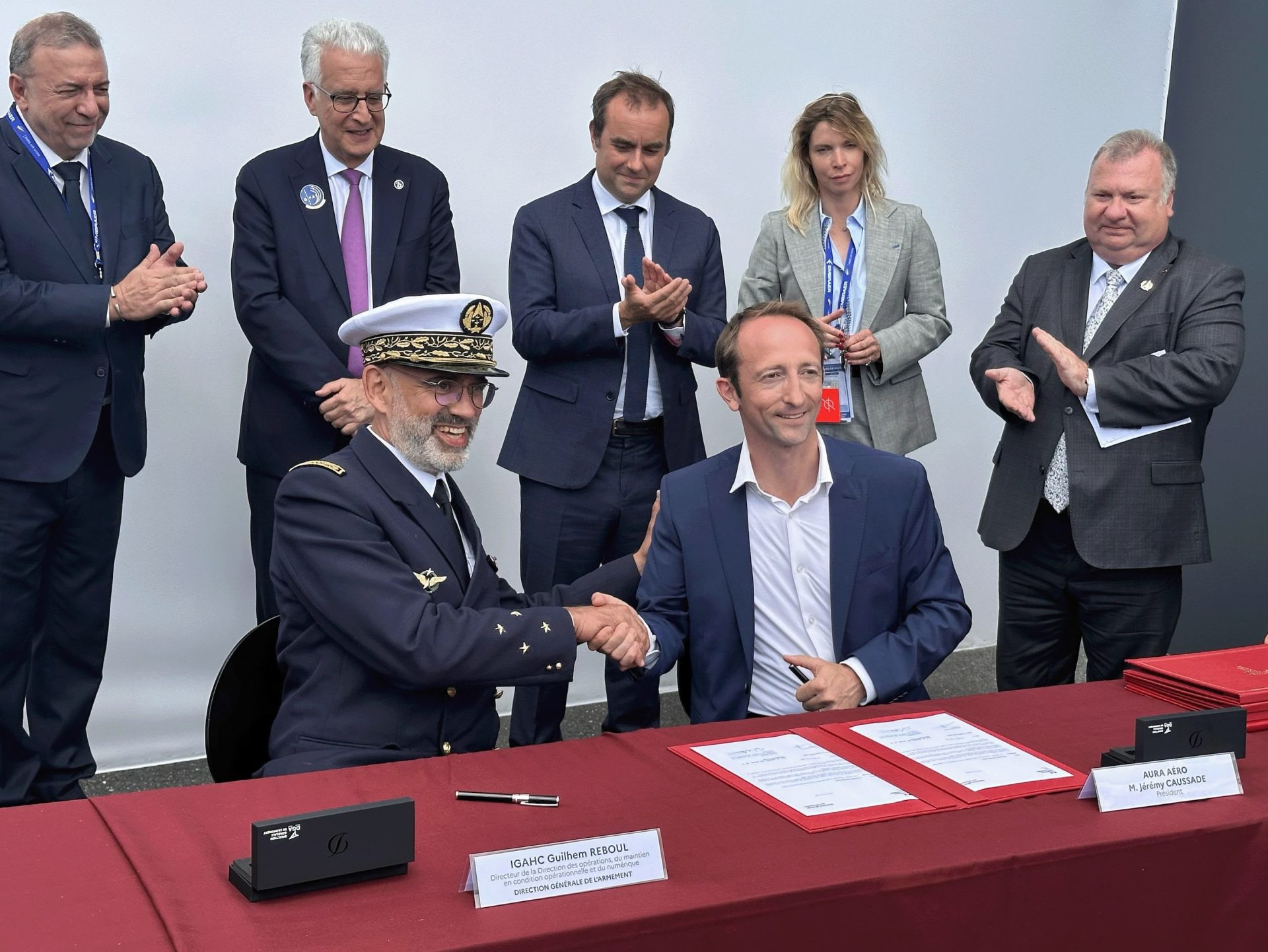 Guilhem REBOUL, Director of Operations, Maintenance, and Digital Technology for the DGA, and Jérémy CAUSSADE, President of AURA AERO - with Sébastien LECORNU, French Minister of Defence, and Emmanuel CHIVA, general delegate for armament.