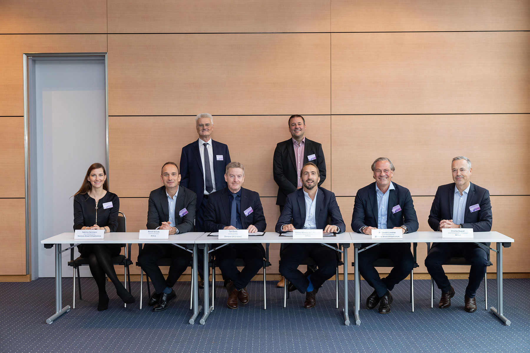 Left to right: Sabrina Herrmann - Head of Buildings Germany, Siemens Smart Infrastructure; Benoit Shultz - Chief Procurement Officer, Airbus; Herbert Klipp - Corporate Account Manager, Siemens; Carl Ennis - CEO Siemens UK & Ireland; Jan Schwarz - Vice President Real Estate & Facility Management Procurement, Airbus; Florent Massou dit Labaquère, EVP Operations Commercial Aircraft, Airbus; Carsten Liesener - Global Head Sales & Operations, Siemens Smart Infrastructure; Charles Huguet - Senior Vice President General Procurement, Airbus