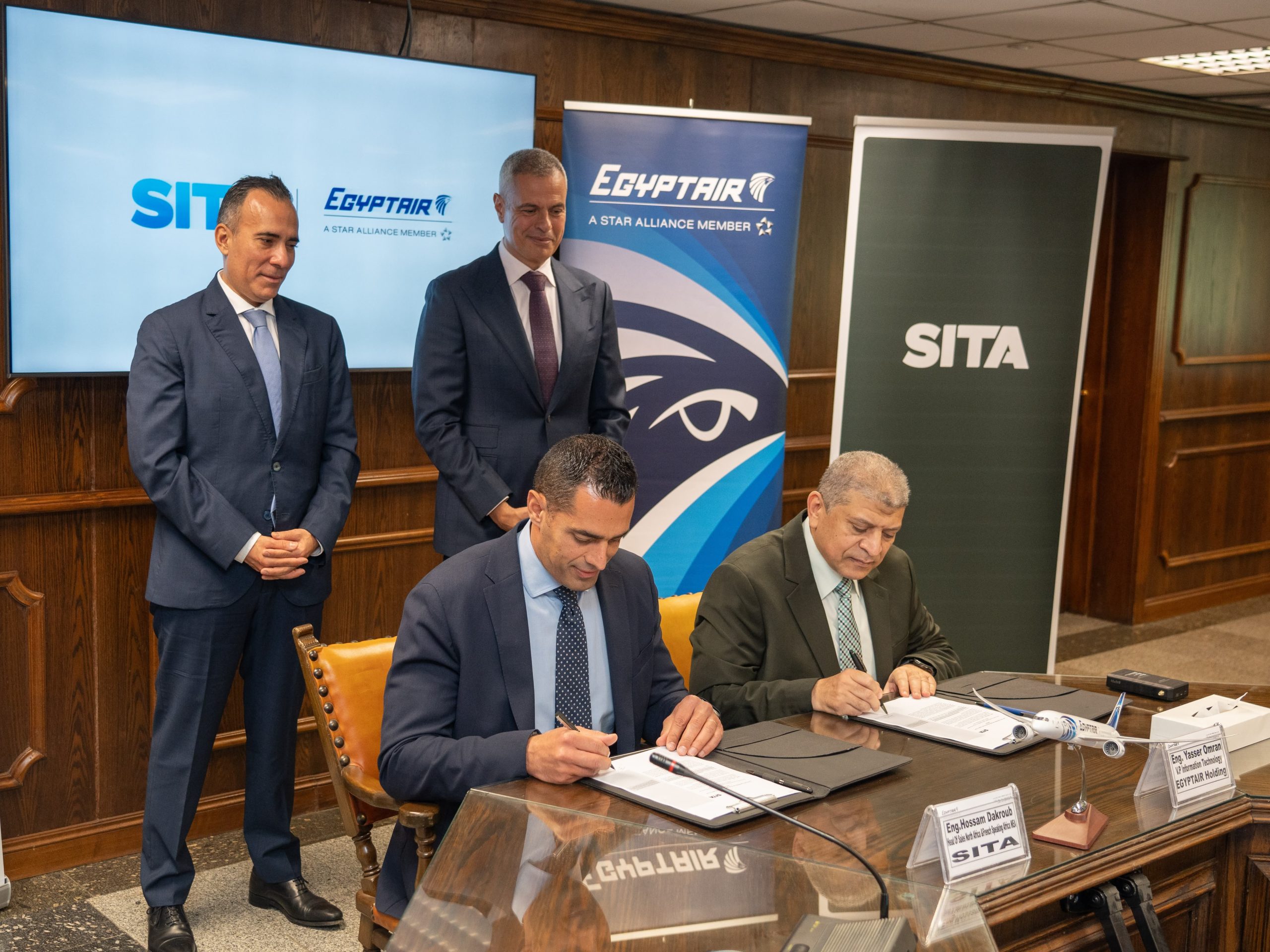 Attached is an image depicting the contract signing. The people in the picture are, from left-to-right: · Selim Bouri, President, Middle East & Africa, SITA (back left) · Capt. Ahmed Adel, Chairman & CEO of EGYPTAIR Holding Company (back right) · Houssam Dakroub, Director, North & French speaking Africa at SITA (front left) · Eng. Yasser Omran, Head of the Information Sector at EGYPTAIR Holding Company (front right)