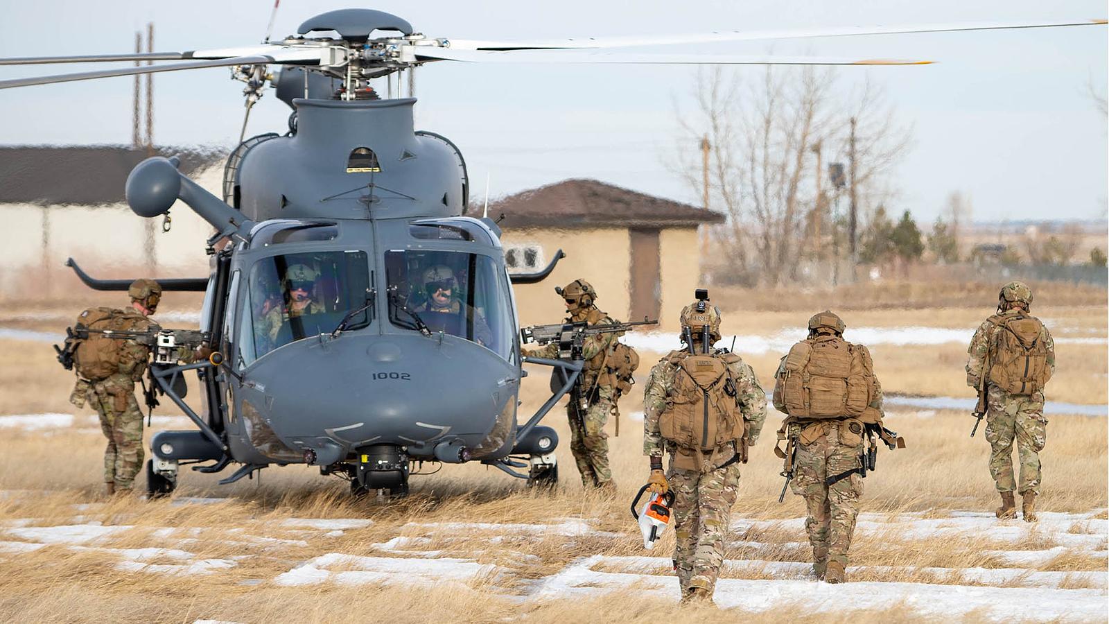 a group of tactical response force airmen assigned to the 341st Missile Security Operations Squadron board an MH-139A Grey Wolf helicopter assigned to the 550th Helicopter Squadron during an IOT&E exercise at Malmstrom Air Force Base, Montana